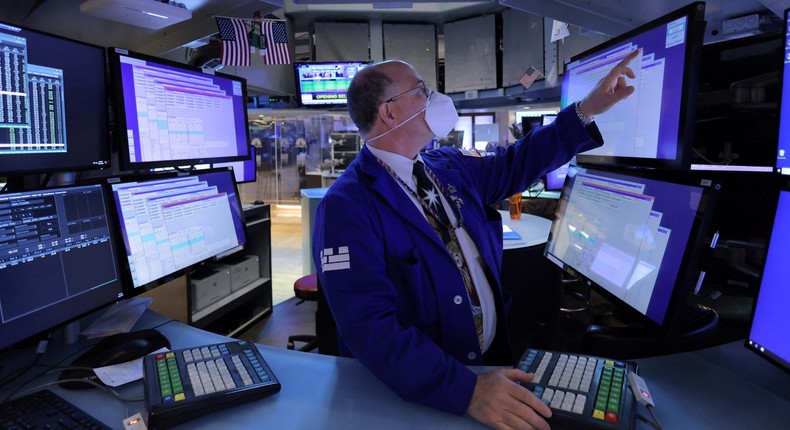 A trader works on the trading floor on the last day of trading before Christmas at the New York Stock Exchange (NYSE) in Manhattan, New York City, U.S., December 23, 2021.