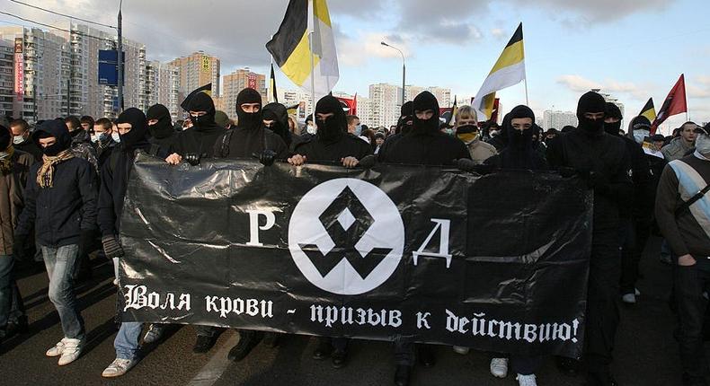 Russian right-wing ultranationalists hold a march in Moscow on November 4, 2009. The sign says the desire of my blood is a call for action.
