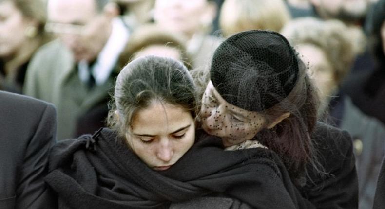 Mazarine Pingeot -- the daughter of former French president Francois Mitterrand -- is comforted by her mother Anne Pingeot, during her father's 1996 funeral in Jarnac