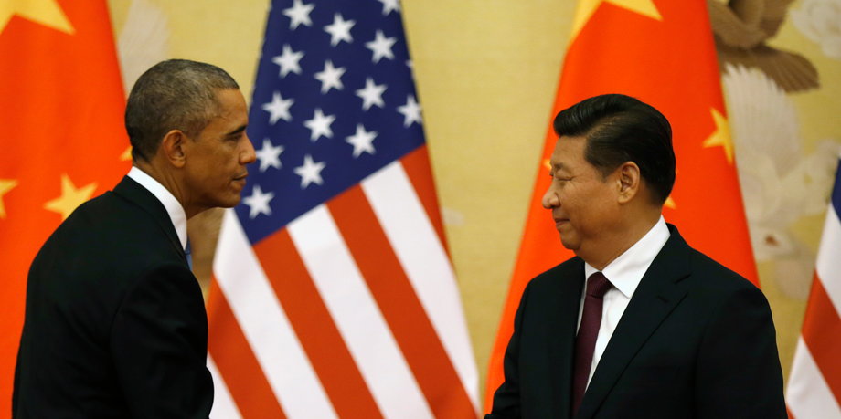 US President Barack Obama, left, and Chinese President Xi Jinping shake hands at the end of their news conference in the Great Hall of the People in Beijing, November 12, 2014.