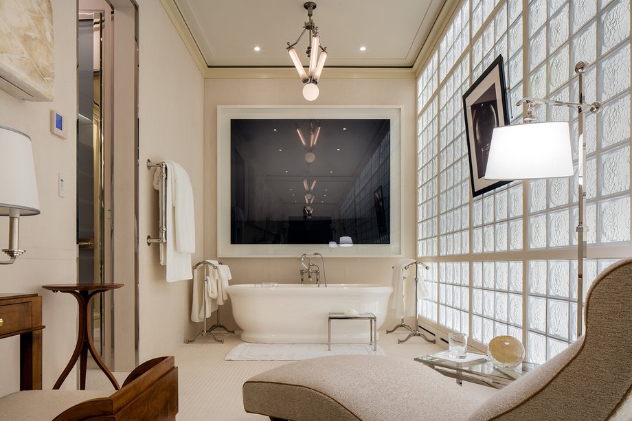 This bathroom — one of five — is filled with filtered light.