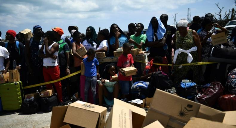 Bahamians waiting to be evacuated from the dock at Marsh Harbour, on the island of Abaco, which was devatsted by hurricane Dorian