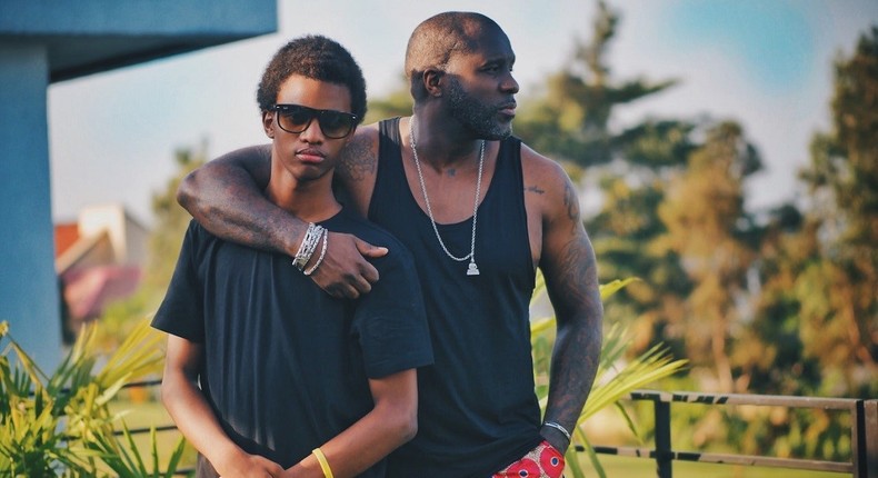 A father and his teenage son posing on a balcony [Photo: Kaysha]