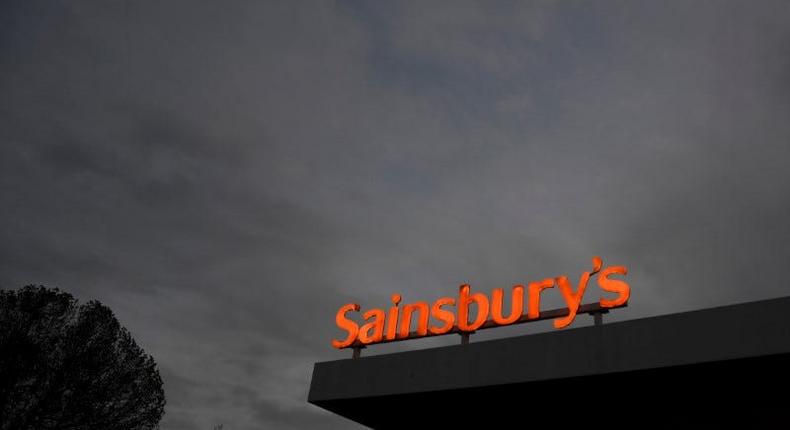 FILE PHOTO:  Sainsbury's signage is seen at a supermarket and petrol station in west London, Britain, November 8, 2017.  REUTERS/Toby Melville