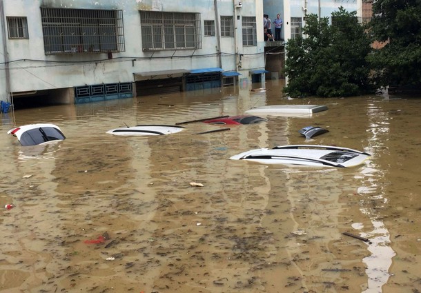 Vehicles are flooded after heavy rainfall in Yongzhou