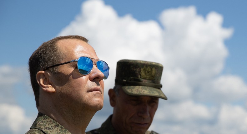 Russia's former president and now serving as deputy chairman of the country's Security Council, Dmitry Medvedev (L), visits the Totsky military training field outside Siberian city of Orenburg on July 14, 2023.YEKATERINA SHTUKINA/SPUTNIK/AFP via Getty Images