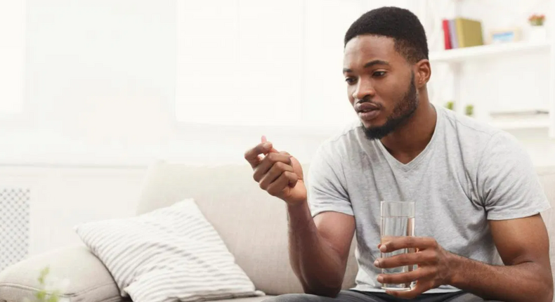 Man taking antibiotics