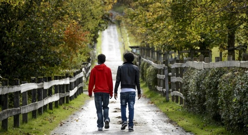 Eritrean asylum seekers walk in the canton of Schwyz in 2014