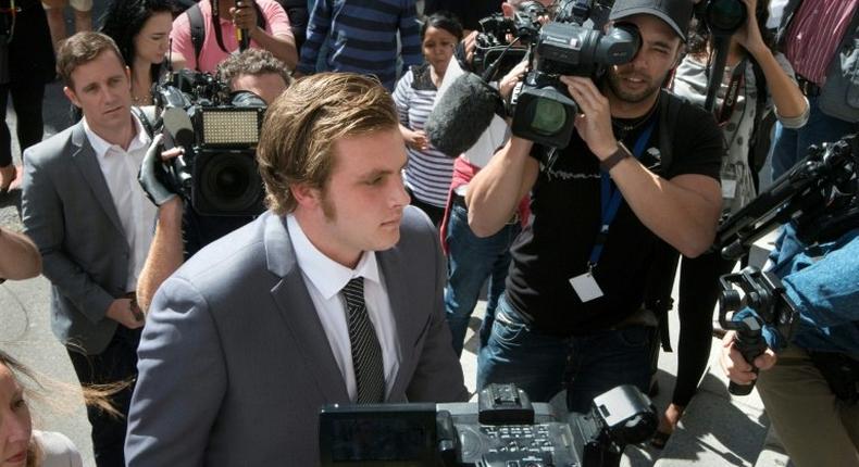 Henri van Breda (C) is alleged to have killed his brother and parents and left his sister struggling with nightmarish injuries in a frenzied axe attack