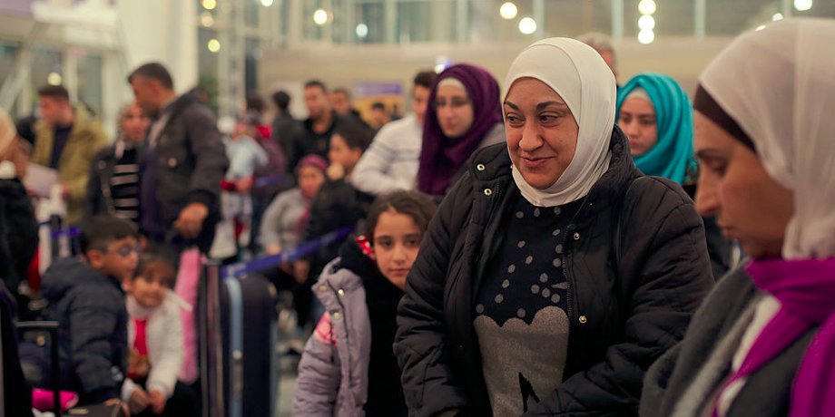 Syrian refugees, Lama Asaaid Alkhateb and her family wait to be board on a special charter flight for Finland at Athens airport on October 31, 2016 in Athens, Greece.