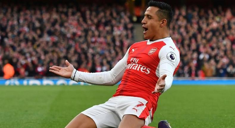 Arsenal's Alexis Sanchez celebrates scoring the opening goal in his team's 3-1 win over Bournemouth on November 27, 2016