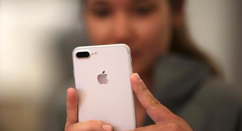 A customer views the new iPhone 7 smartphone inside an Apple Inc. store in Los Angeles