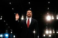 Former FBI Director James Comey sworn in to testify at a hearing in Washington