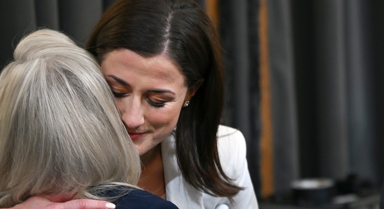 Cassidy Hutchinson, a top former aide to Trump White House Chief of Staff Mark Meadows, hugs U.S. Rep. Liz Cheney (R-WY) after testifying during the sixth hearing by the Jan 6. House committee on June 28, 2022 in Washington, DC.