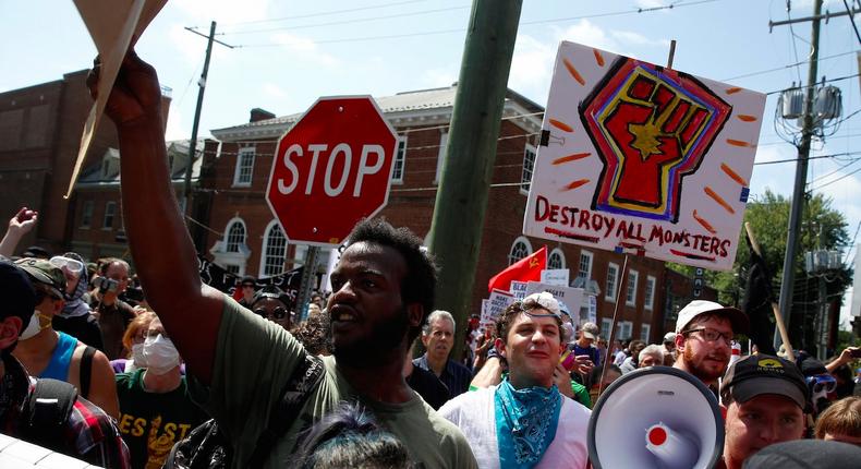 A group of counter-protesters march against members of white nationalist protesters in Charlottesville, Virginia, U.S., August 12, 2017.