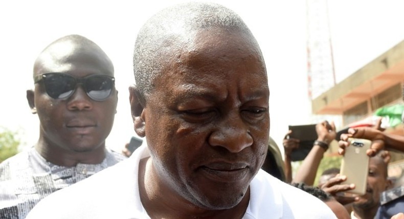 President and candidate of Ghana's ruling National Democratic Congress party John Mahama leaves after voting in the Bole district, northern region, on December 7, 2016