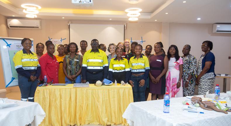 Newmont and Project C.U.R.E officials with health professionals.