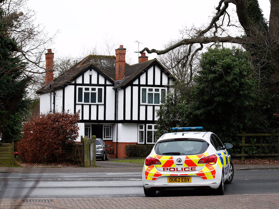 A police car drives past an address which has been linked by local media to former British intelligence officer Christopher Steele, who has been named as the author of an intelligence dossier on President-elect Donald Trump, in Wokingham, Britain, January 12, 2016.