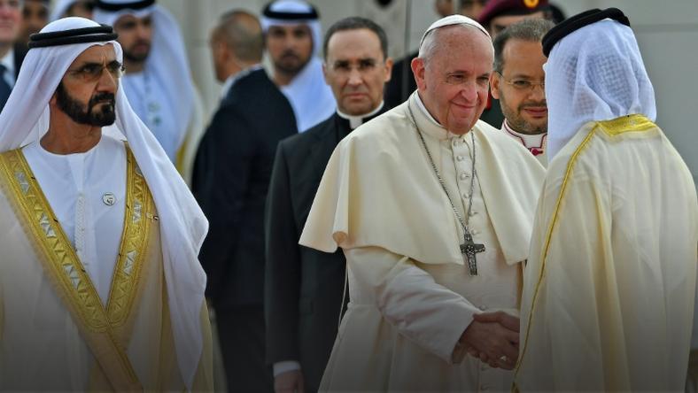 Dubai ruler Sheikh Mohammed bin Rashid Al-Maktoum accompanies Pope Francis as he meets dignitaries during a welcome ceremony in Abu Dhabi on February 4, 2019