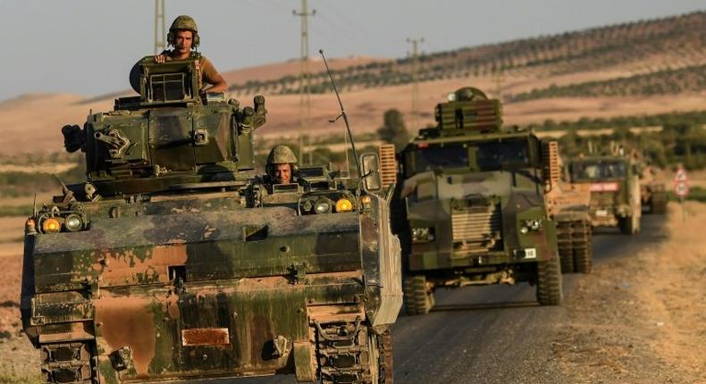 Turkish soldiers drive back to Turkey from the Syrian-Turkish border town of Jarabulus in September 2016