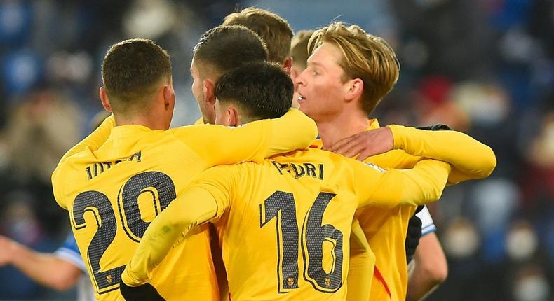 Frenkie de Jong (right) celebrates scoring the winner for Barcelona against Alaves on Sunday. Creator: Ander GILLENEA