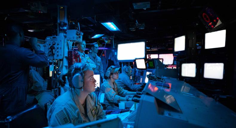 Sailors assigned to the Arleigh Burke-class guided-missile destroyer USS Carney (DDG 64) stand watch in the ship's Combat Information Center during an operation to defeat a combination of Houthi missiles and unmanned aerial vehicles, Oct. 19.US Navy photo by Mass Communication Specialist 2nd Class Aaron Lau