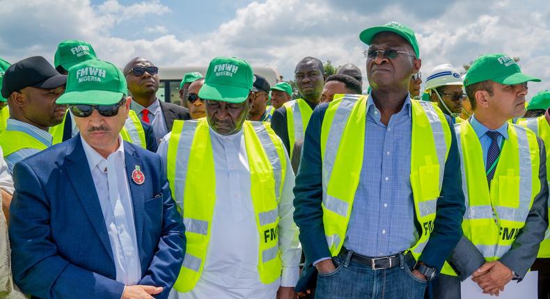 Minister of Works and Housing, Babatunde Raji Fashola on project inspection with contractors. 