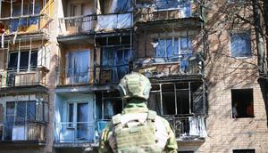 A local volunteer looks at a building damaged by Ukrainian strikes in Kursk on August 16, 2024, following Ukraine's offensive into Russia's western Kursk region.TATYANA MAKEYEVA/AFP via Getty Images