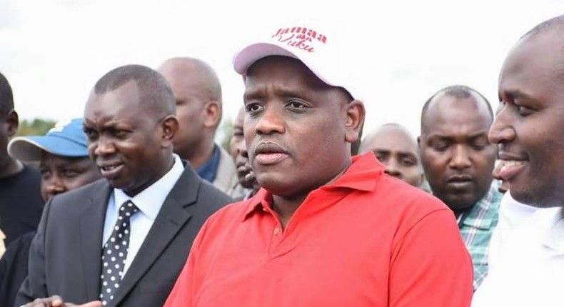 File image of Dennis Itumbi (in a red shirt) flanked by Kapseret MP Oscar Sudi (Left) at a past event