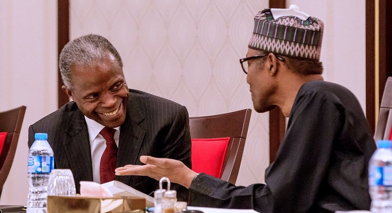 Vice President, Yemi Osinbajo, and President Muhammadu Buhari discuss a t a meeting at the State House on August 28, 2018