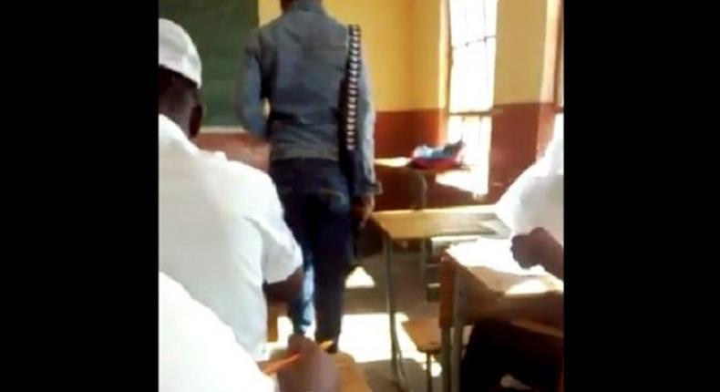 Teacher suspended for supervising exam with firearm