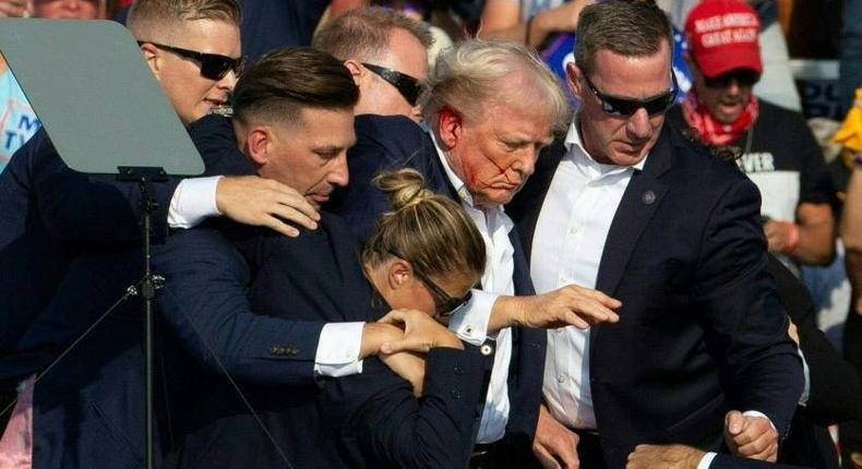 Secret Service agents surrounded Trump after an assassination attempt in July 2024.REBECCA DROKE/Getty Images