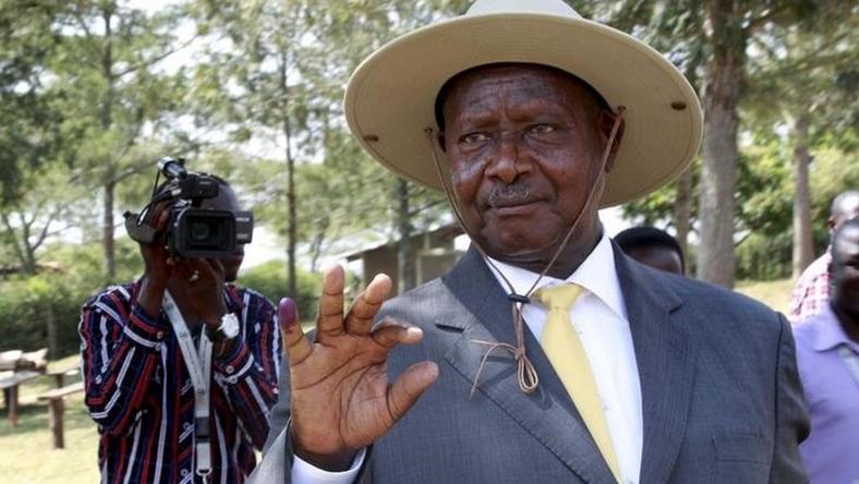 Uganda's incumbent President Yoweri Museveni displays his inked finger after casting his vote at a polling station during the presidential elections in Kirihura in western Uganda, February 18, 2016. REUTERS/James Akena