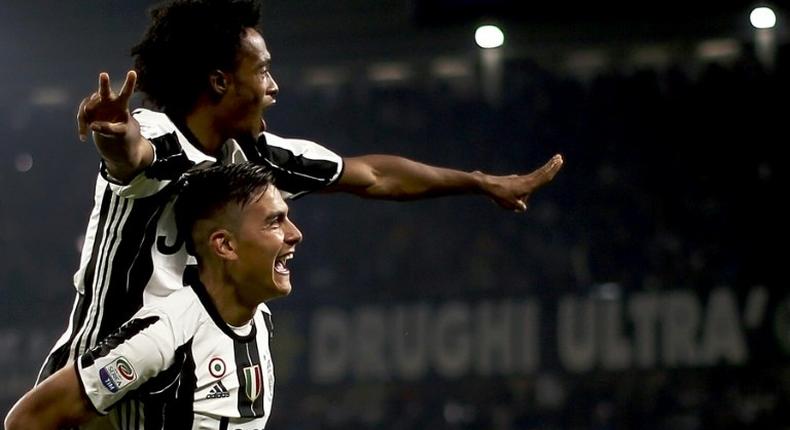 Juventus' forward Paulo Dybala (down) has been tipped for success by rival Diego Perotti