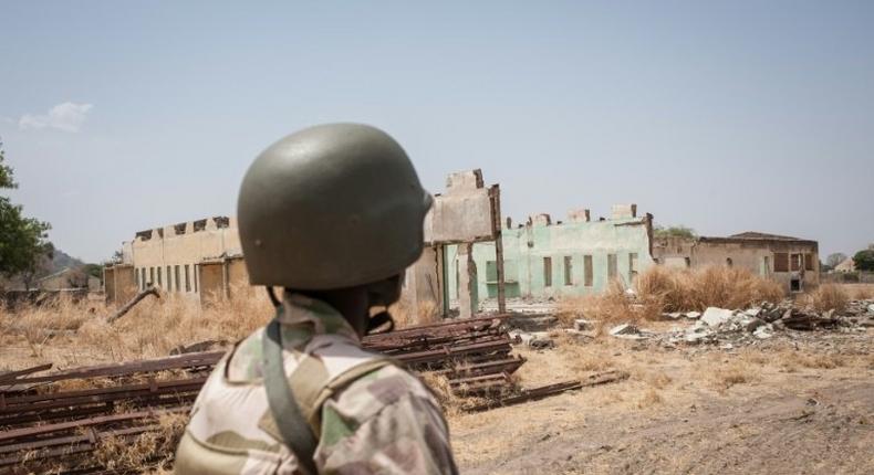 A Nigerian soldier on patrol in Chibok, the scene of a mass kidnapping of schoolgirls by Boko Haram in 2014