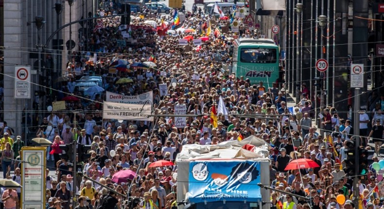 Thousands protested in Berlin  urging a day of freedom from restrictions, with some demonstrators dubbing the pandemic the biggest conspiracy theory