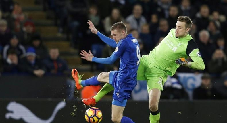 Liverpool's goalkeeper Simon Mignolet (R) clashes with Leicester City's striker Jamie Vardy at King Power Stadium in Leicester, central England on February 27, 2017