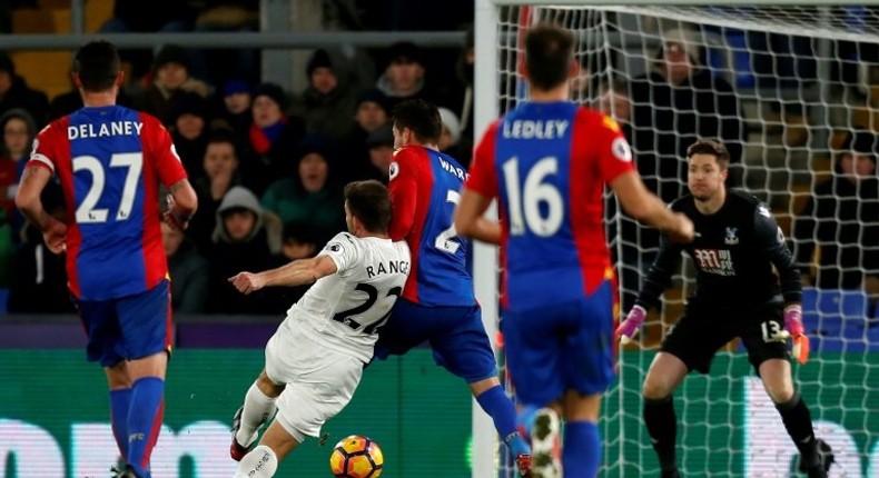 Swansea City's Angel Rangel shoots to score their second goal against Crystal Palace in south London on January 3, 2017