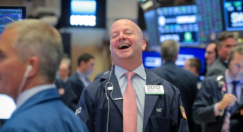 FILE PHOTO: Traders work on the floor at the New York Stock Exchange (NYSE) in New York, U.S., June 24, 2019. REUTERS/Brendan McDermid/File Photo