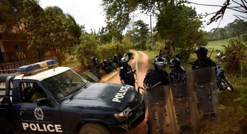 Ugandan policemen guard a checkpoint on the outskirts of Kampala, in February 2016