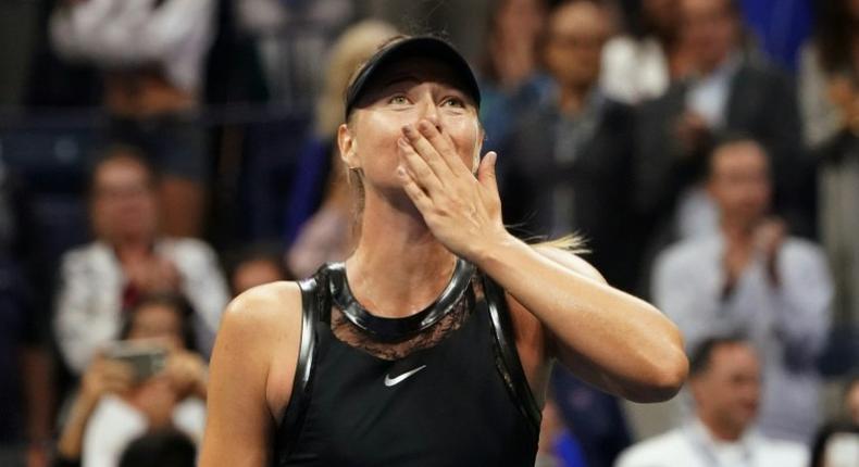 Maria Sharapova of Russia celebrates her victory over Simona Halep of Romania in their 2017 US Open first round match, in New York, August 28