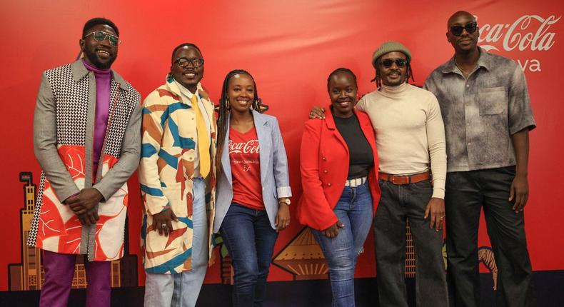 Polycarp, Chimano, Savara and Bien from Sauti Sol pose for a photo with Isabelle Rostom Kariuki, Coca Cola's Marketing Director, East and Central Africa at the Sol Fest partnership announcement between Coke Studio and Sauti Sol at the Coca Cola office on October 31