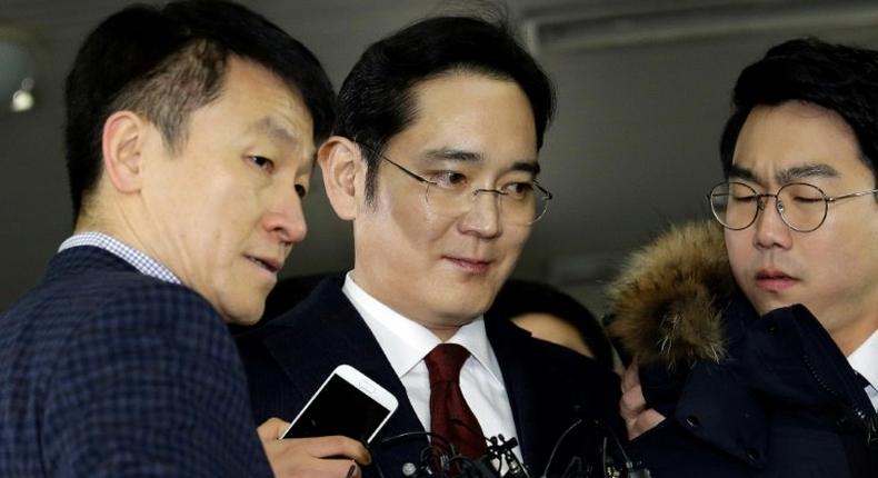 Lee Jae-yong (C) vice chairman of Samsung Electronics, is to be questioned over bribery allegations in the corruption scandal surrounding South Korean President Park Geun-Hye