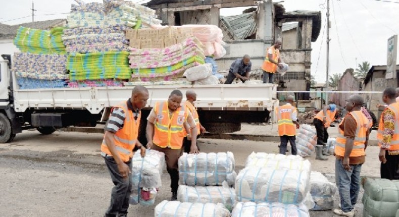 NADMO distributing relief items to flood and fire victims