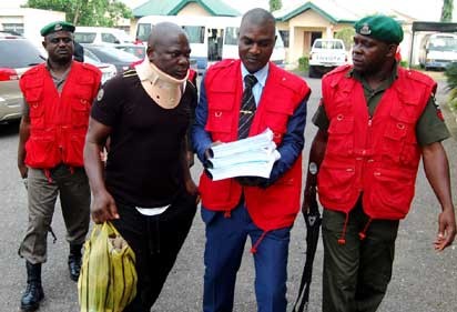 EFCC operatives leading fresh suspects in the N8 billion CBN staff fraud to the court premises in Ibadan, Oyo State  