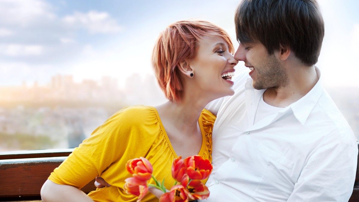 Young happy smiling attractive couple together outdoors