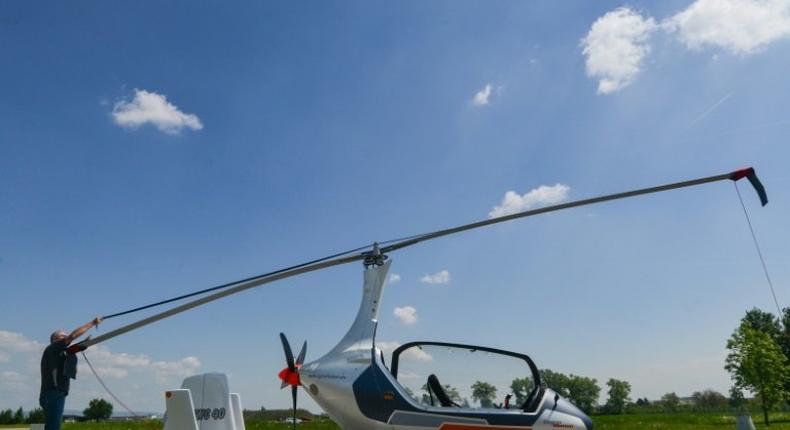 Czech pilot Pavel Brezina (L), owner of Nirvana Autogyro company, has made a GyroDrive -- a mini helicopter you can drive.