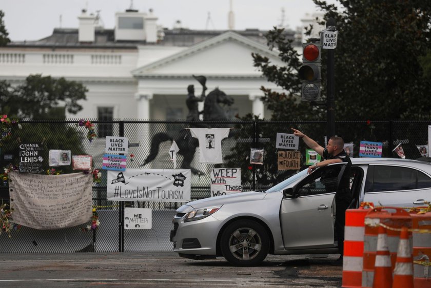 Police officers stop a suspect after a shooting incident outside of the White House, in Washington