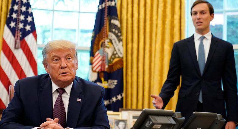 President Donald Trump listens as Jared Kushner speaks in the Oval Office of the White House on September 11, 2020.