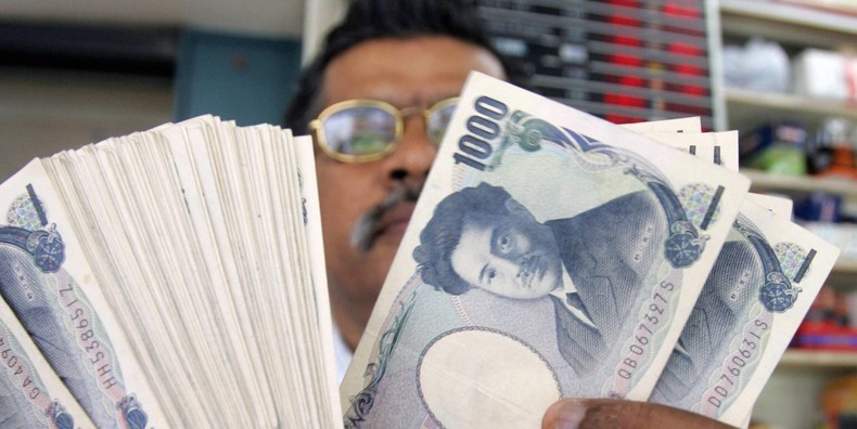 A money changer counts Japanese Yen notes in Singapore.THERESA BARRACLOUGH/AFP via Getty Images